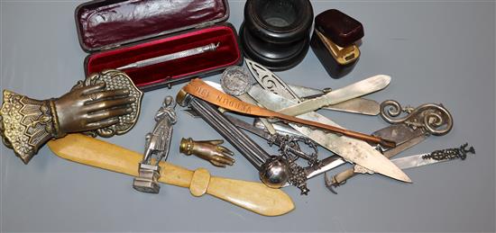 A white metal propelling pencil and assorted writing accessories